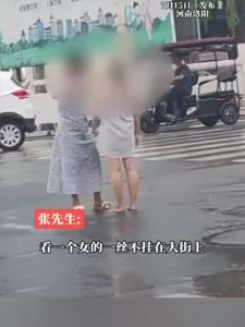 河南洛阳一女子街头全身赤裸 好心路人用围巾将其裹上