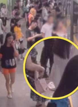 广州一男子地铁站内偷拍女性裙底被抓